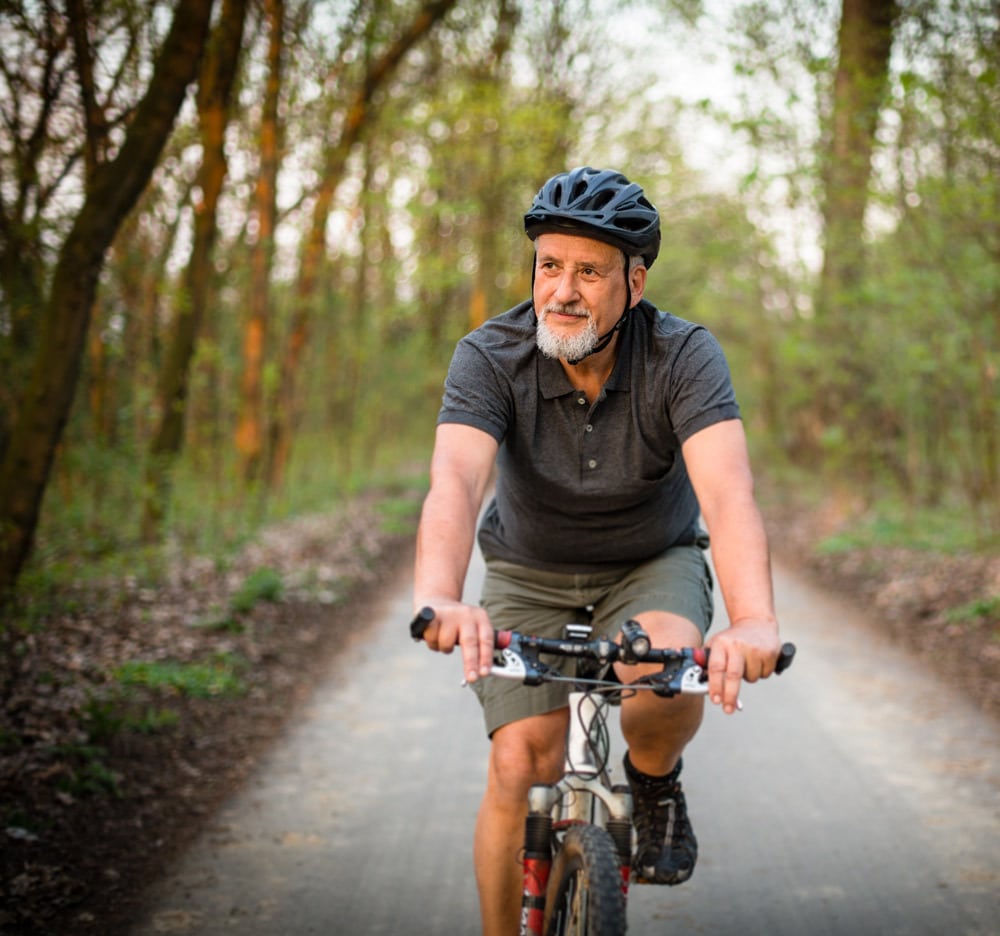 old man enjoying bike